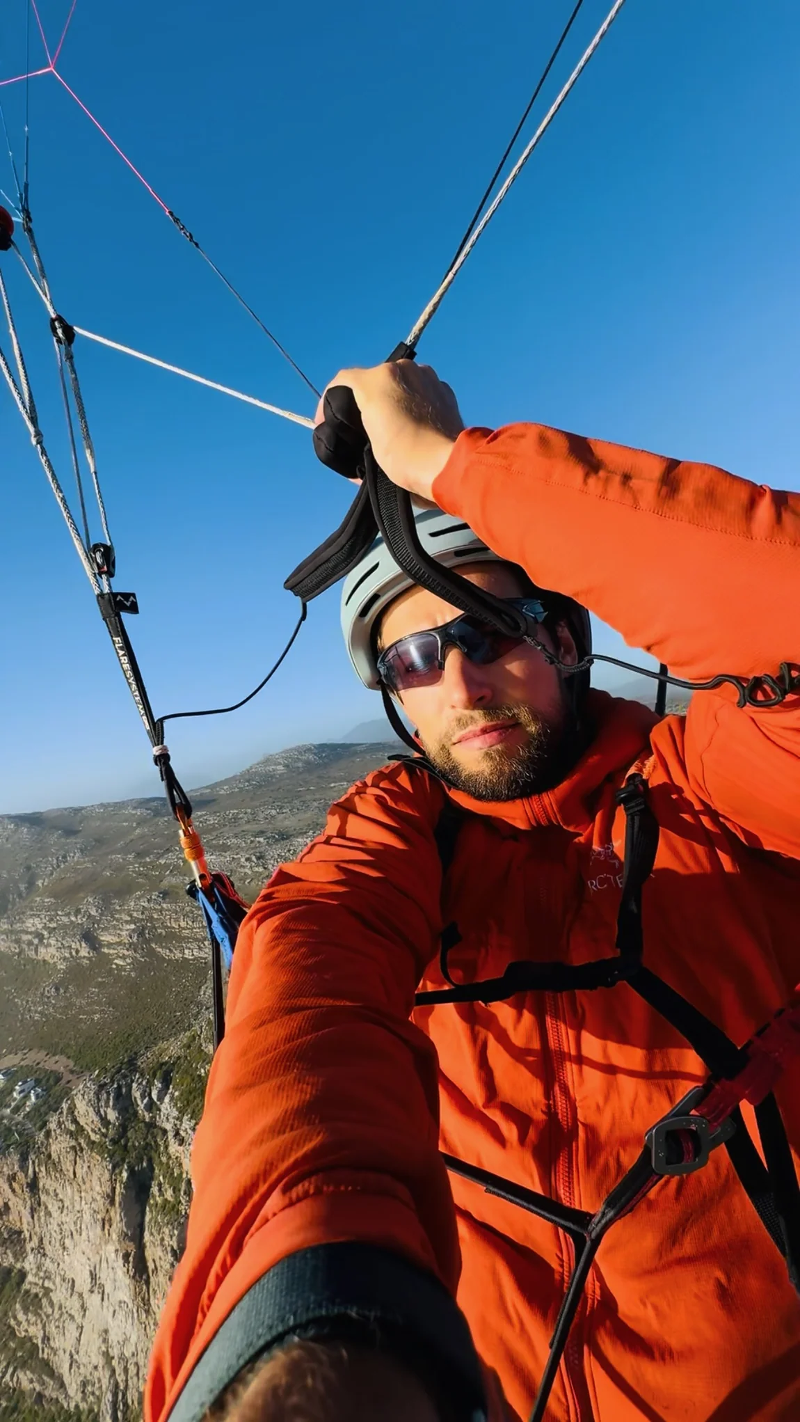 In-flight paragliding portrait of Shawn